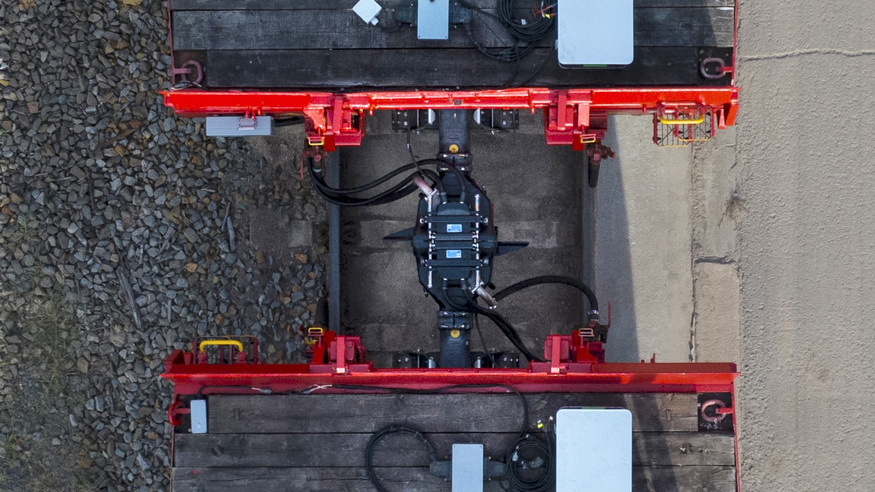 Top Down Shot of to rail freight wagons coupled with a Digital Automatic Coupler DAC